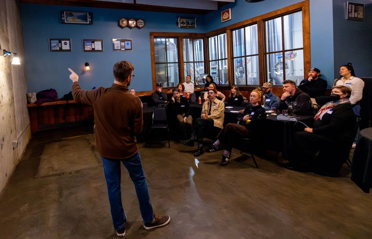 David speaking to a seated audience in a meetup room